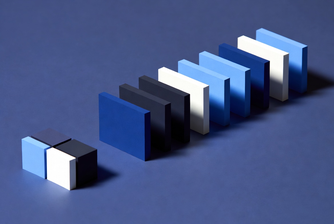 A small compact cluster of blocks beside a long accumulating row of upright panels receding across a deep blue surface, representing owned media assets compounding in value over time.